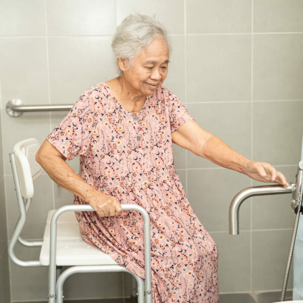 Asian senior or elderly old lady woman patient use toilet bathroom handle security in nursing hospital, healthy strong medical concept.